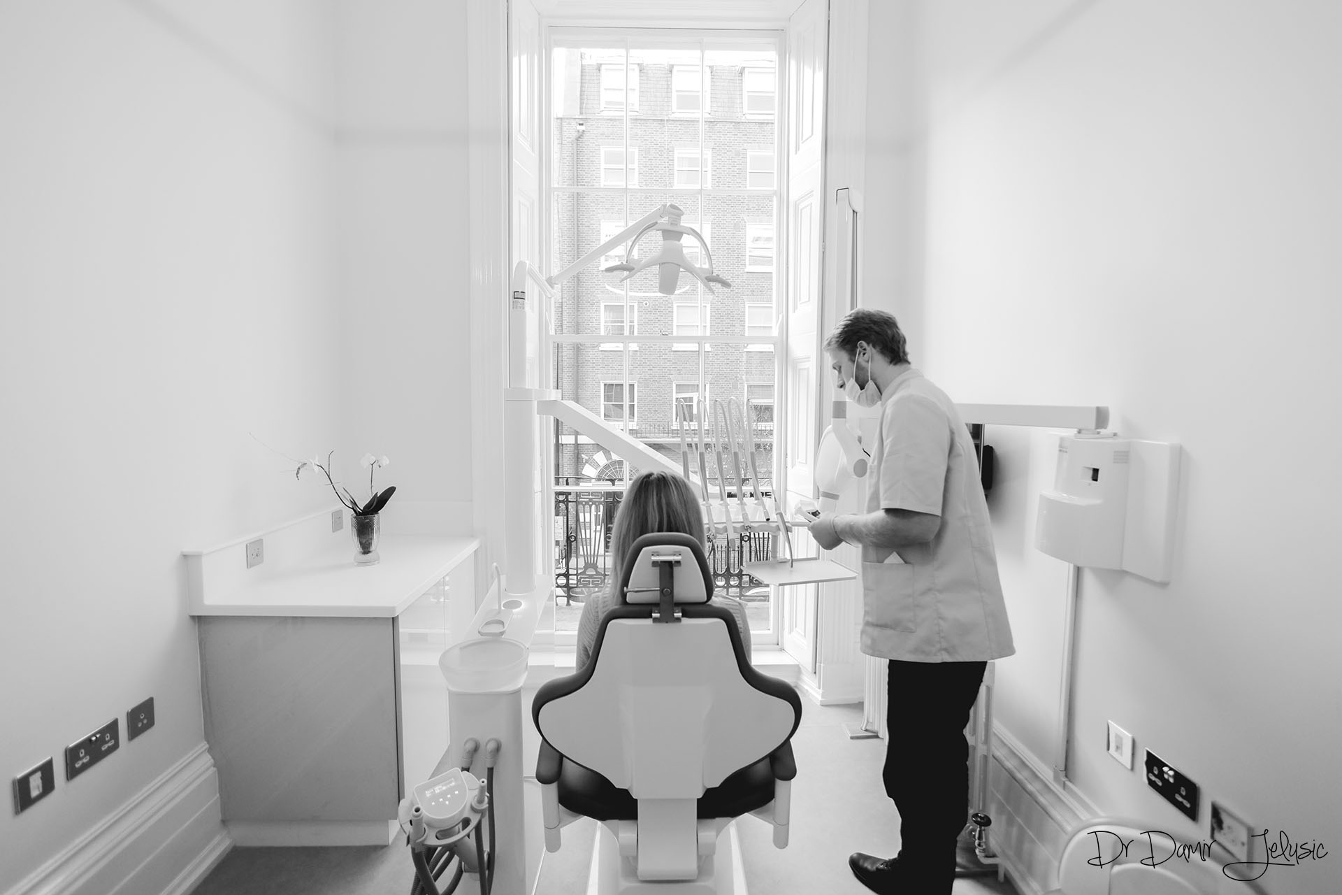 Dentist working in a modern dental surgery at our Chelsea clinic, Nobel Biocare dental implants London
