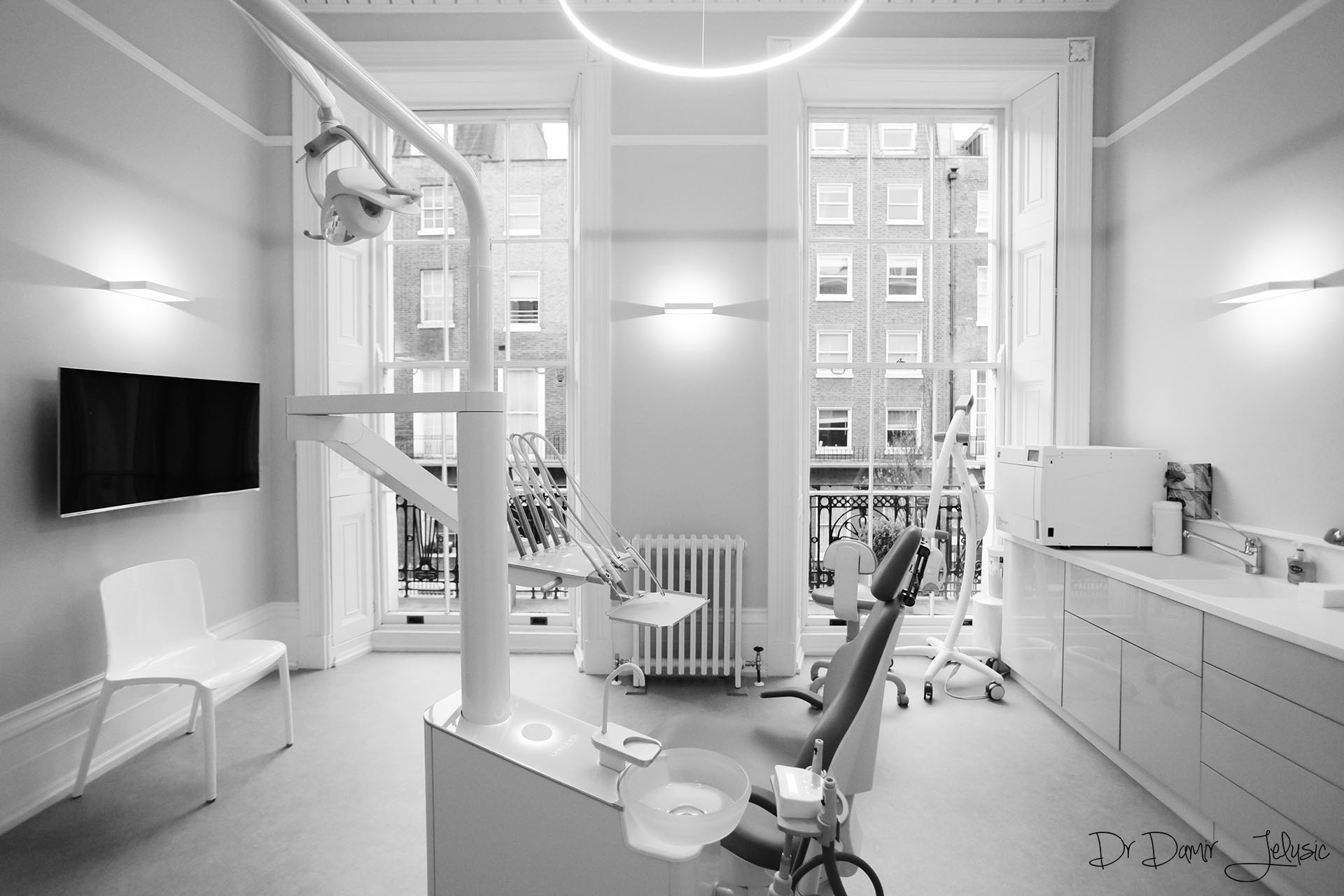 Black and white photo of a modern dental surgery room at our Chelsea clinic, Nobel Biocare dental implants London