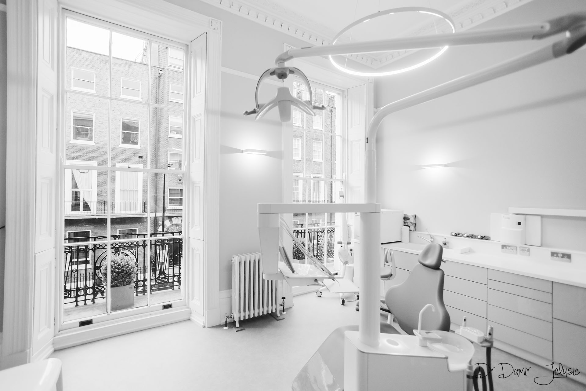 Black and white photo of a modern dental surgery room at our Chelsea clinic, Nobel Biocare dental implants London
